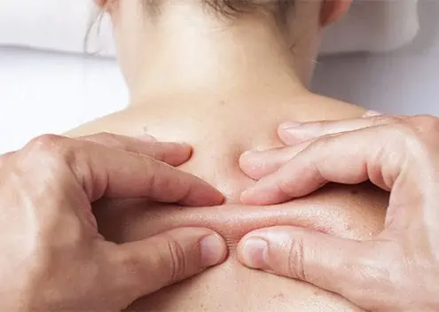 A massage therapist performing Myofascial Release Therapy.